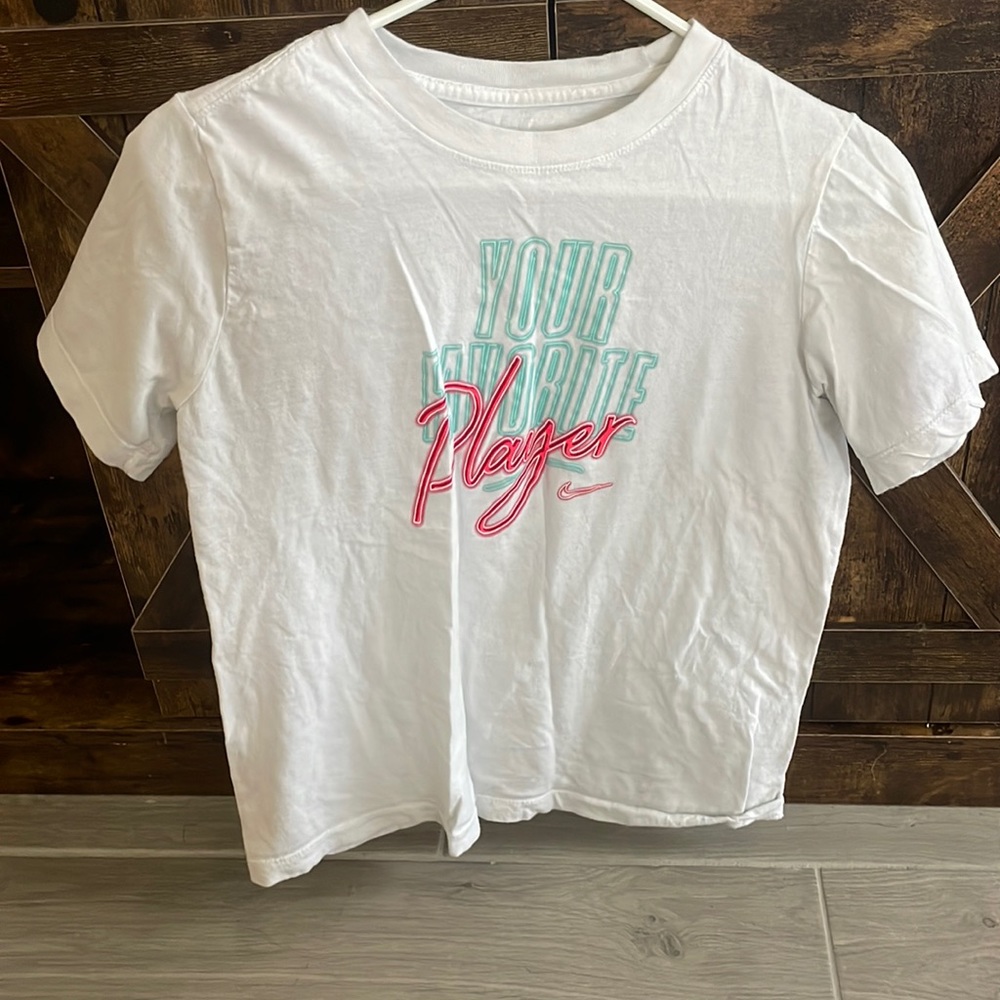 “your favorite player” nike woman’s tee shirt.